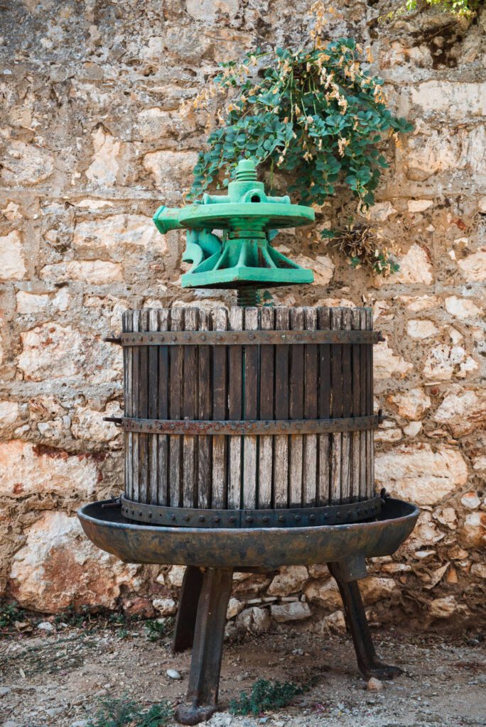 Old grape press in front of the old stone house on Hvar Island - Part of Hvar Wine and Olive Oil Tour